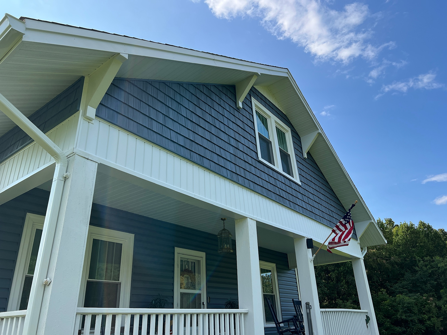 Close-up of front porch and shake gable